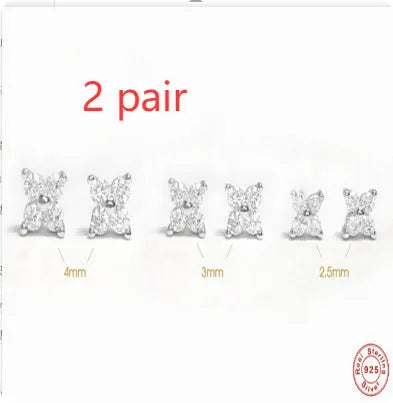 S925 sterling silver stud earrings with small petal-shaped crystal flowers in gold or platinum finish.