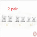 S925 sterling silver stud earrings with small petal-shaped crystal flowers in gold or platinum finish.