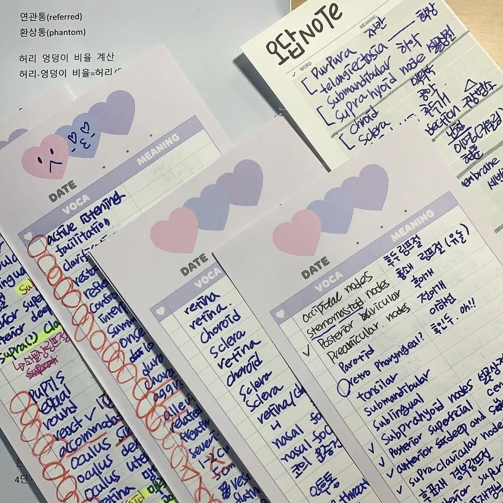 Blue B5 half-size vertical notepad with 30 sheets next to pink and purple versions.