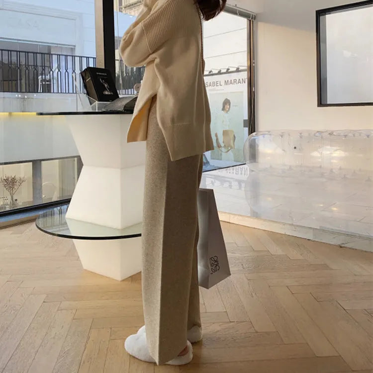 Women's high-waisted wide-leg knitted trousers in cream white, casual autumn winter style.