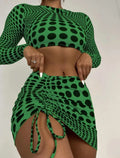 Women's green polka dot three-piece swimsuit set with bikini top and skirt