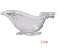 Transparent acrylic bird shaped manual lemon juicer with dimensions 12x3.5x5.1cm on a clean countertop