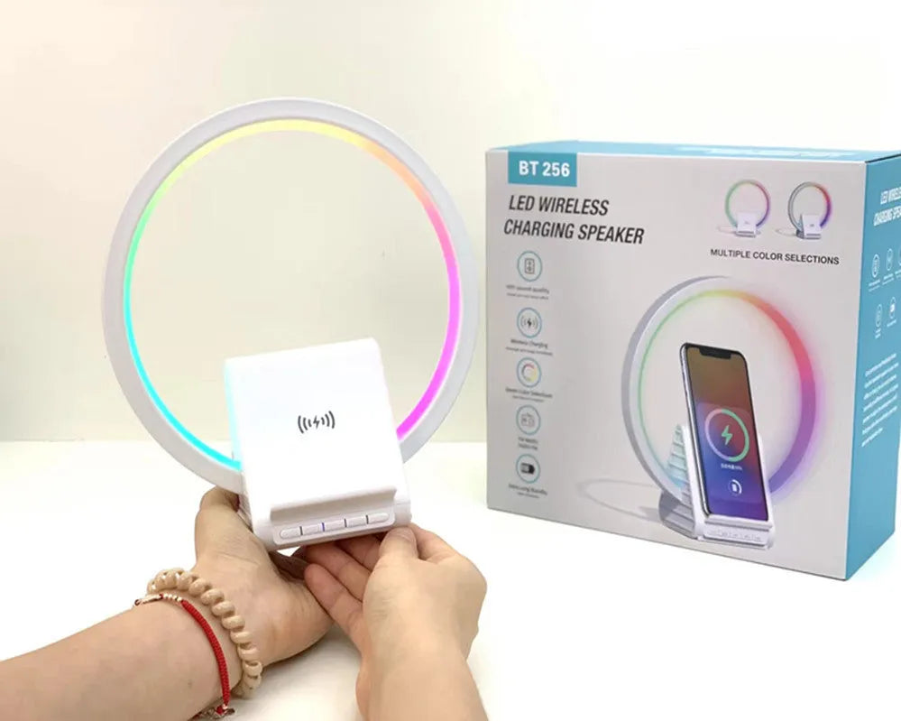 White smart Bluetooth speaker with wireless charging surface and LED ambience lighting