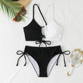 Women's black and white contrast colour cross sling hollow bikini set in polyester, front view