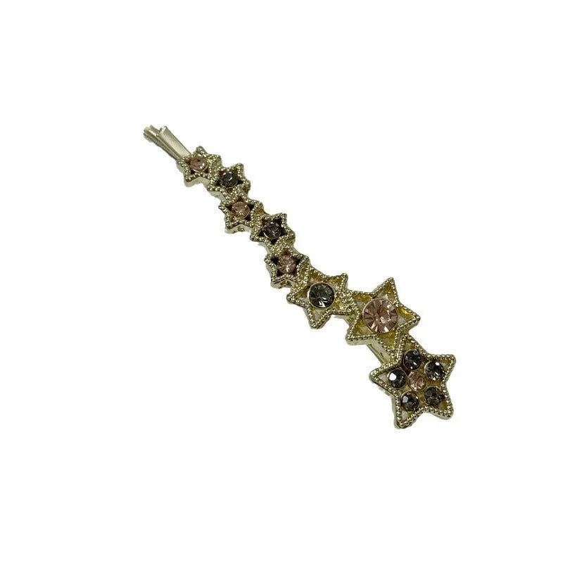 Gold-coloured Korean style hair barrette with a star and letter decoration, shown as a side clip for bangs.