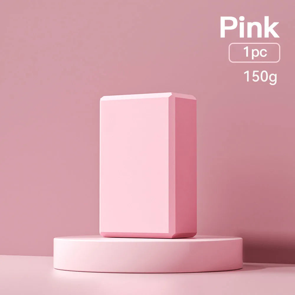 Solid colour EVA foam yoga block with hexagonal ridges, shown next to tape measure showing 23cm length