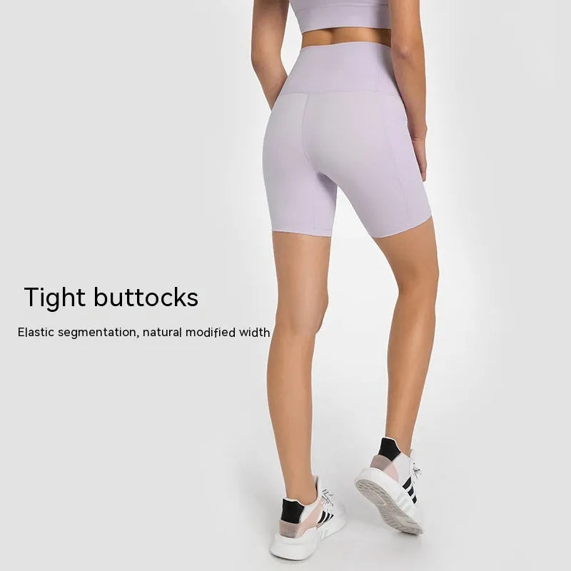Women's tight-fitting super stretch sports shorts in a solid colour, shown on a model.