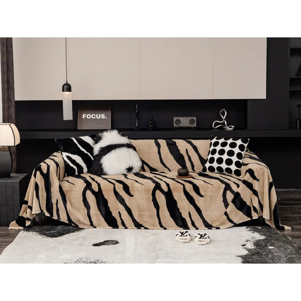 Zebra pattern flannel sofa cover with matching pillowcase in caramel colour on grey sofa