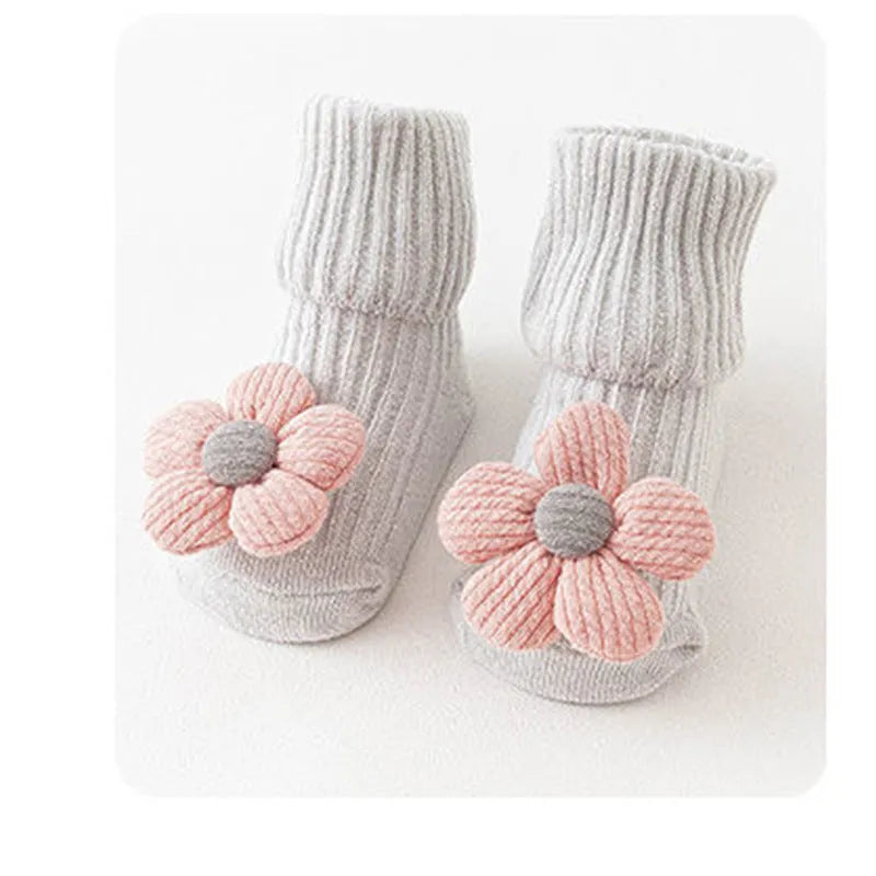 Cotton baby floor socks in various colours and patterns including bows, stars, and animal designs