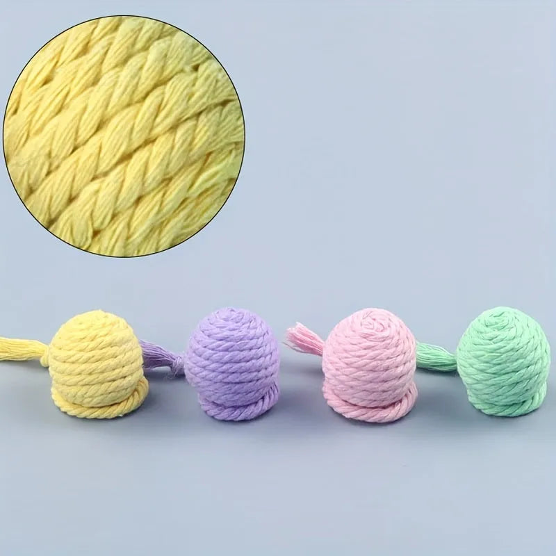 Colourful cat toy ball with attached rope and internal bell in green, pink, purple, and yellow options