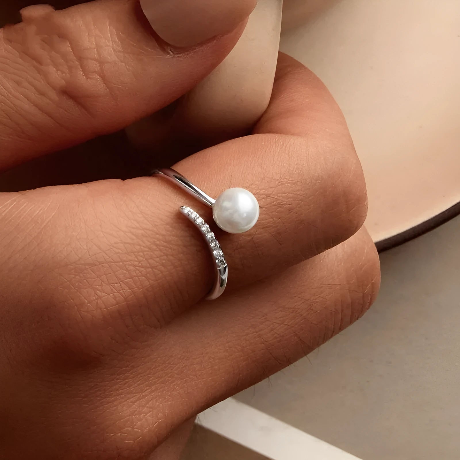 S925 sterling silver adjustable ring with natural shell pearl centrepiece showing open loop design