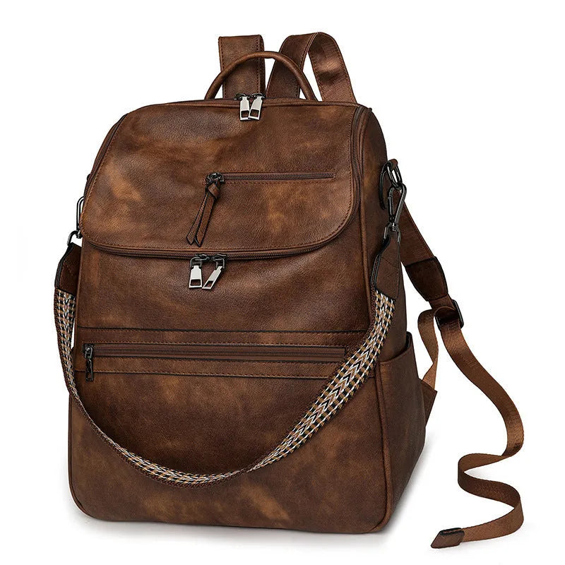 Retro college style PU backpack with curved shoulder straps shown in a solid colour with stitching detail.