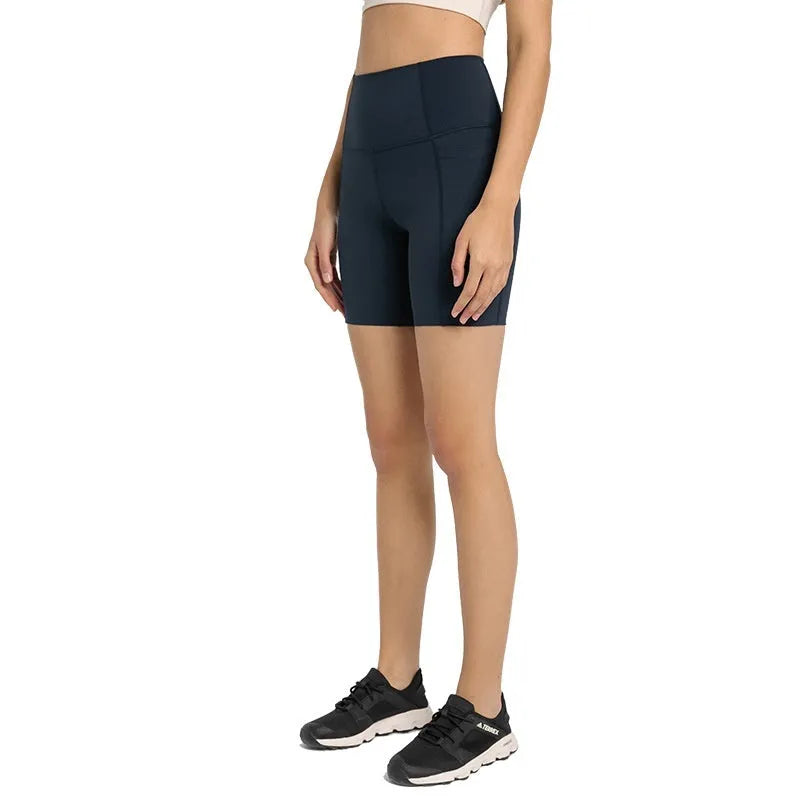 Women's tight-fitting super stretch sports shorts in a solid colour, shown on a model.