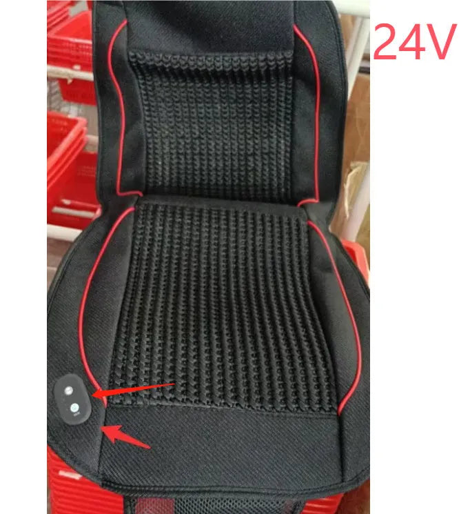 Black minimalist car ventilation seat cushion with power cord on a car seat.