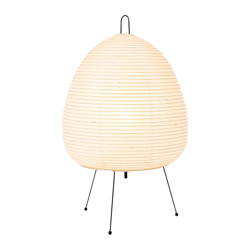 Japanese style table lamp with handmade paper shade and aluminium base on a wooden surface.