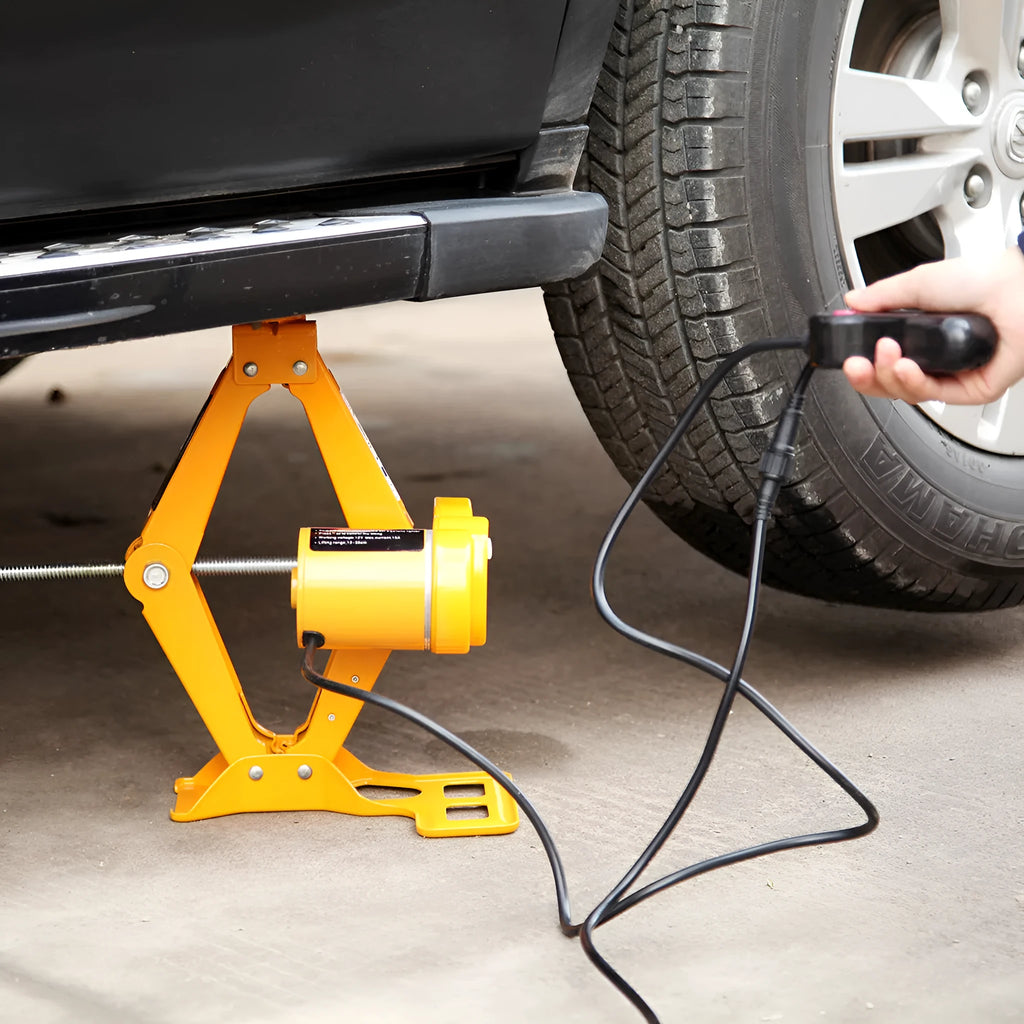Vehicle-mounted electric hydraulic jack kit with a 2-tonne capacity on a grey background.