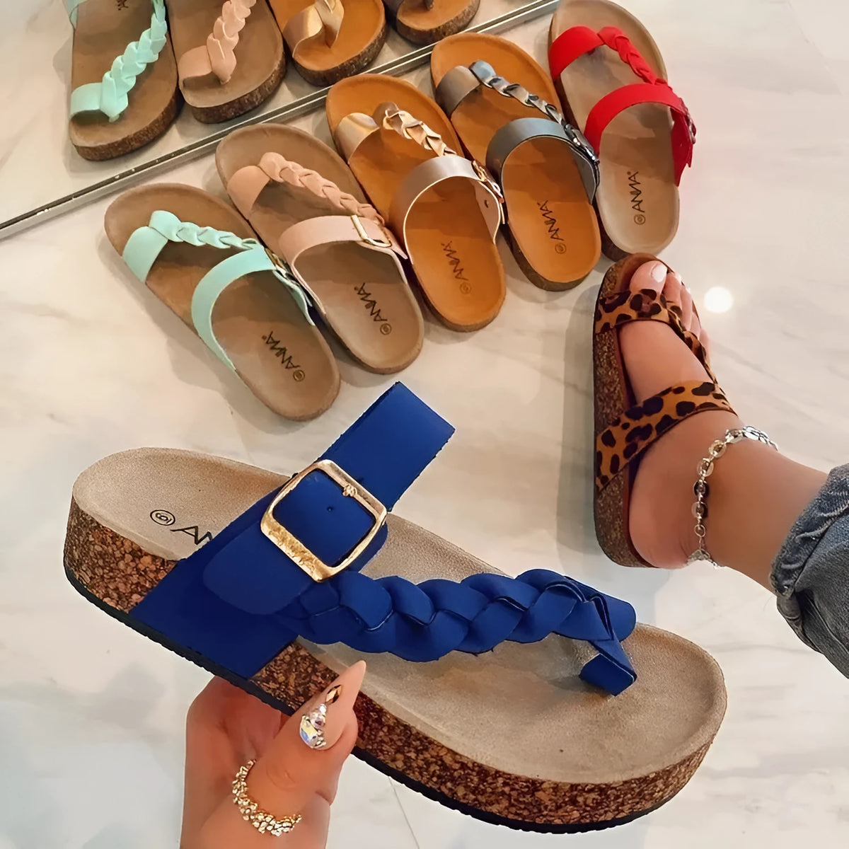 Women's cork flip flops with cow suede upper, decorative stitching, and rubber sole in blue shade