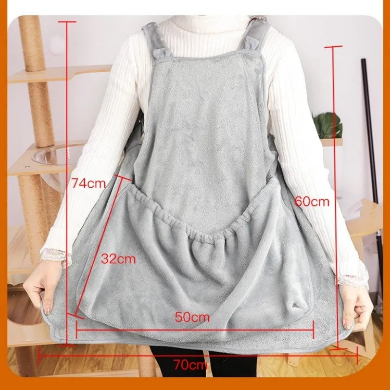 Plush pet carrier apron for small cats and dogs with adjustable strap and head opening.