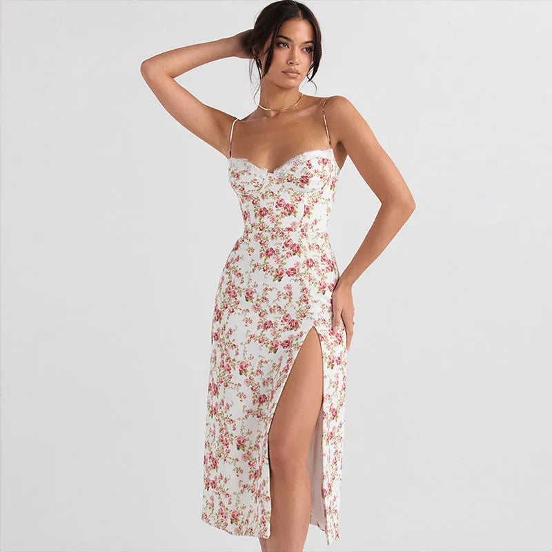 Women's blue lace flower print long dress with thigh slit and black suspender straps.