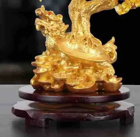 Citrine-coloured resin Feng Shui ornament of a water turtle with a money tree.