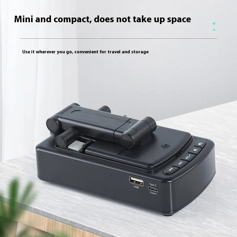 Multifunctional plastic tablet and phone holder with audio in black on a desk