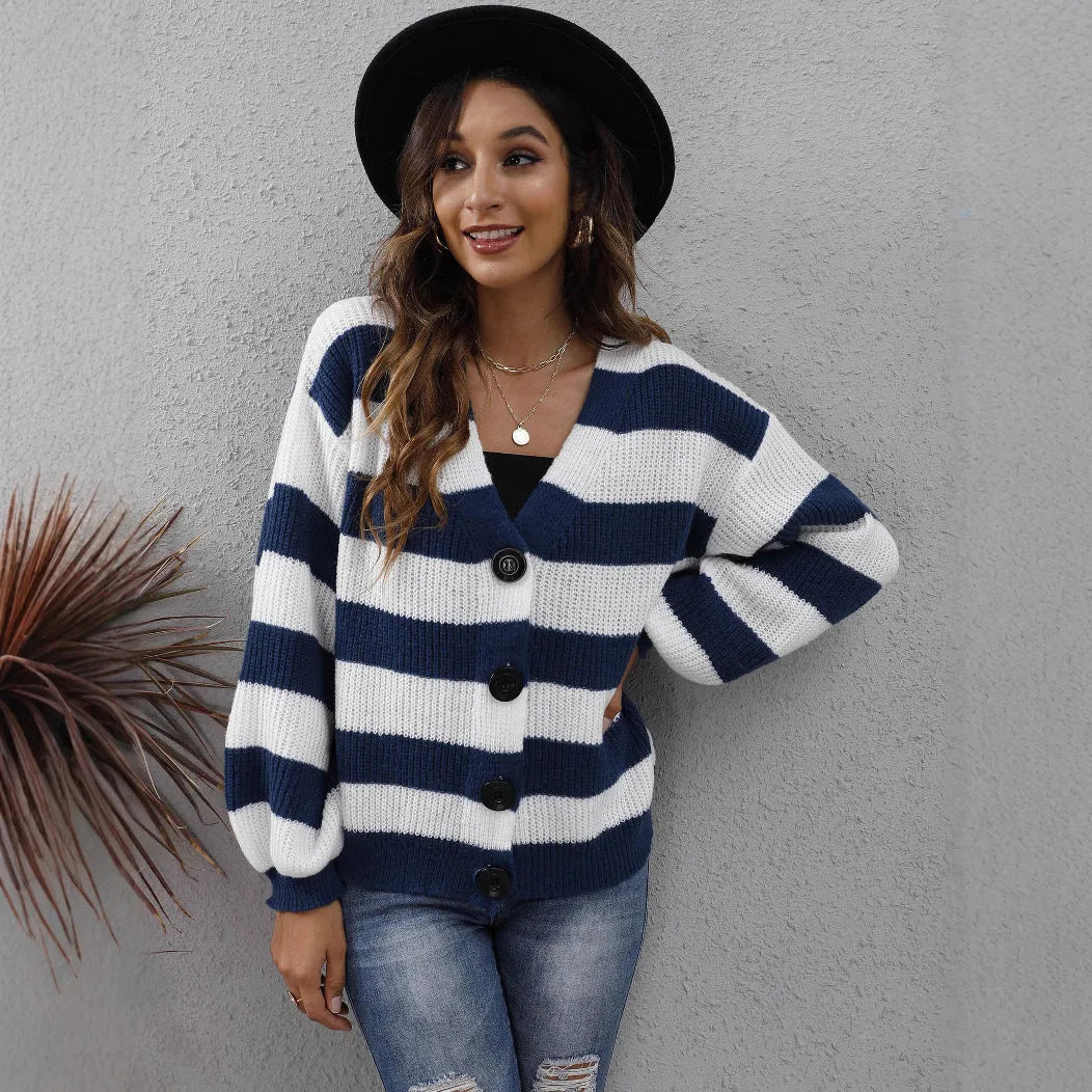 Blue and black striped women's cardigan sweater with button front and regular sleeves.
