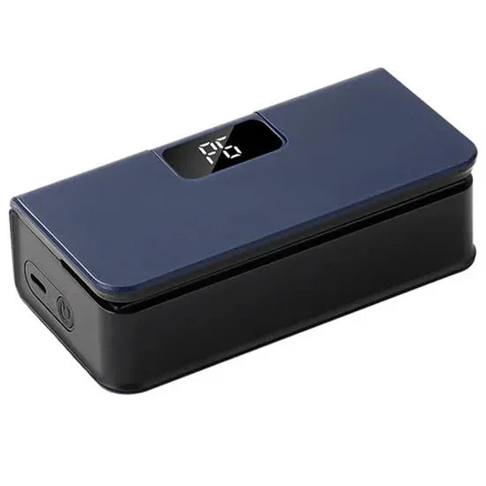 Small white handheld heat sealing machine for plastic food bags on a kitchen worktop.