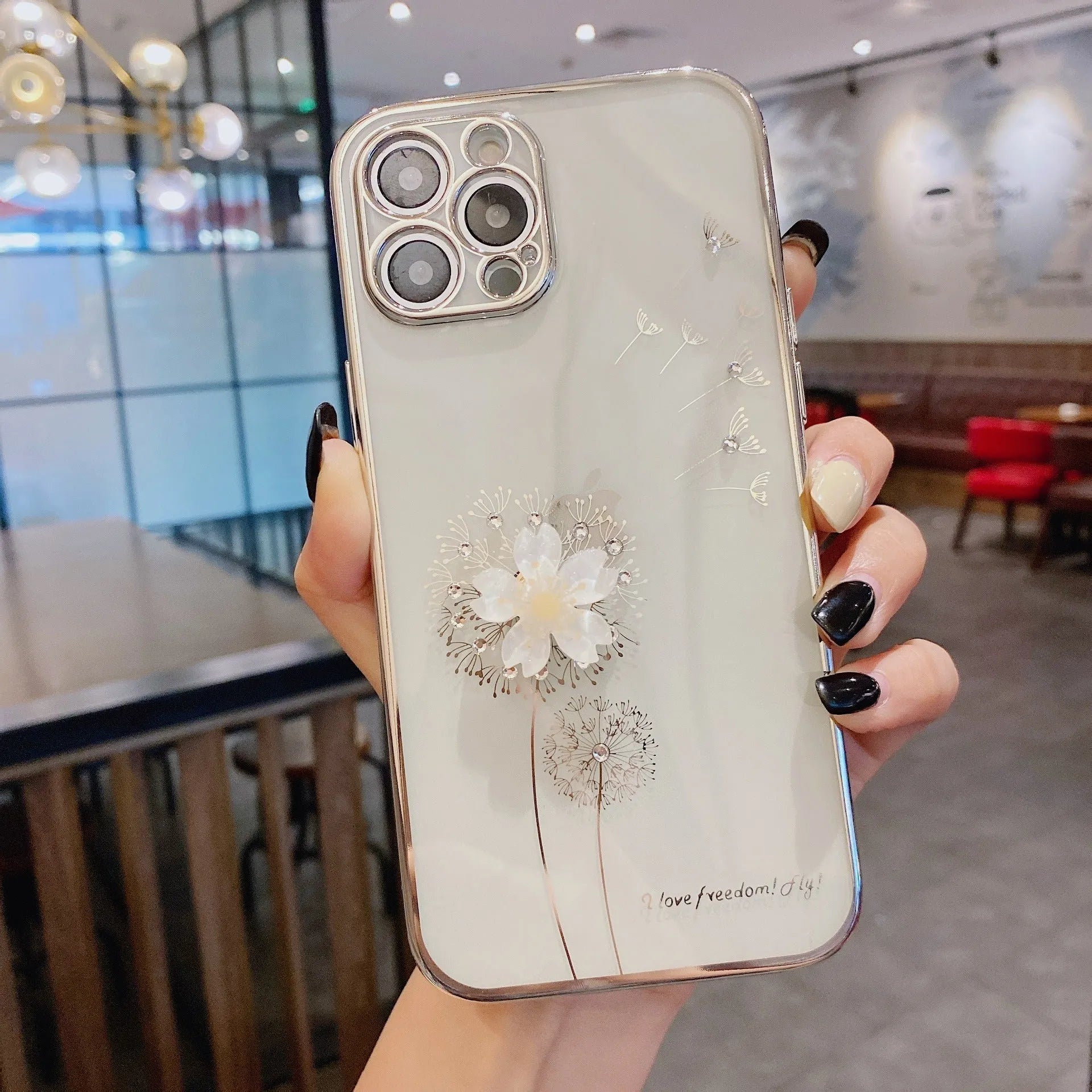 Green 3D flower spin stand phone case for iPhone on a table, showing built-in screen protector and stand.