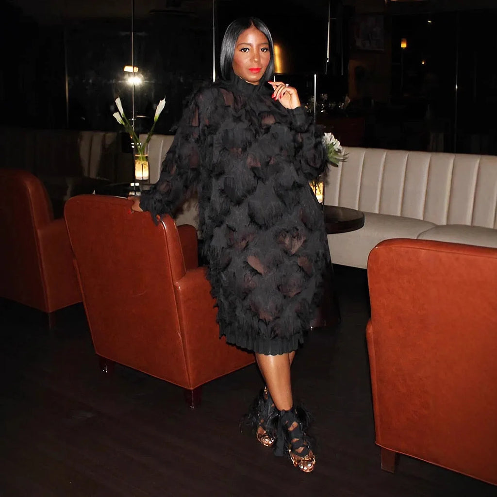 Black chiffon fringe loose mid-length dress with stand collar and long sleeves on a model