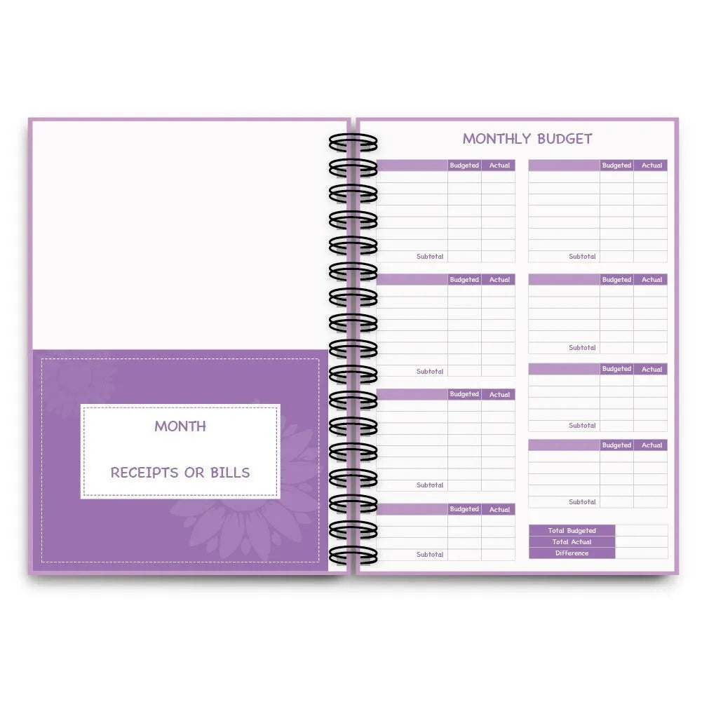 Purple coil-bound financial planning notebook with pen, stickers and paper clips for monthly budgeting