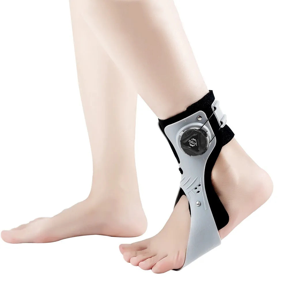 Grey and black ankle fixation brace with airbag button compression for training support