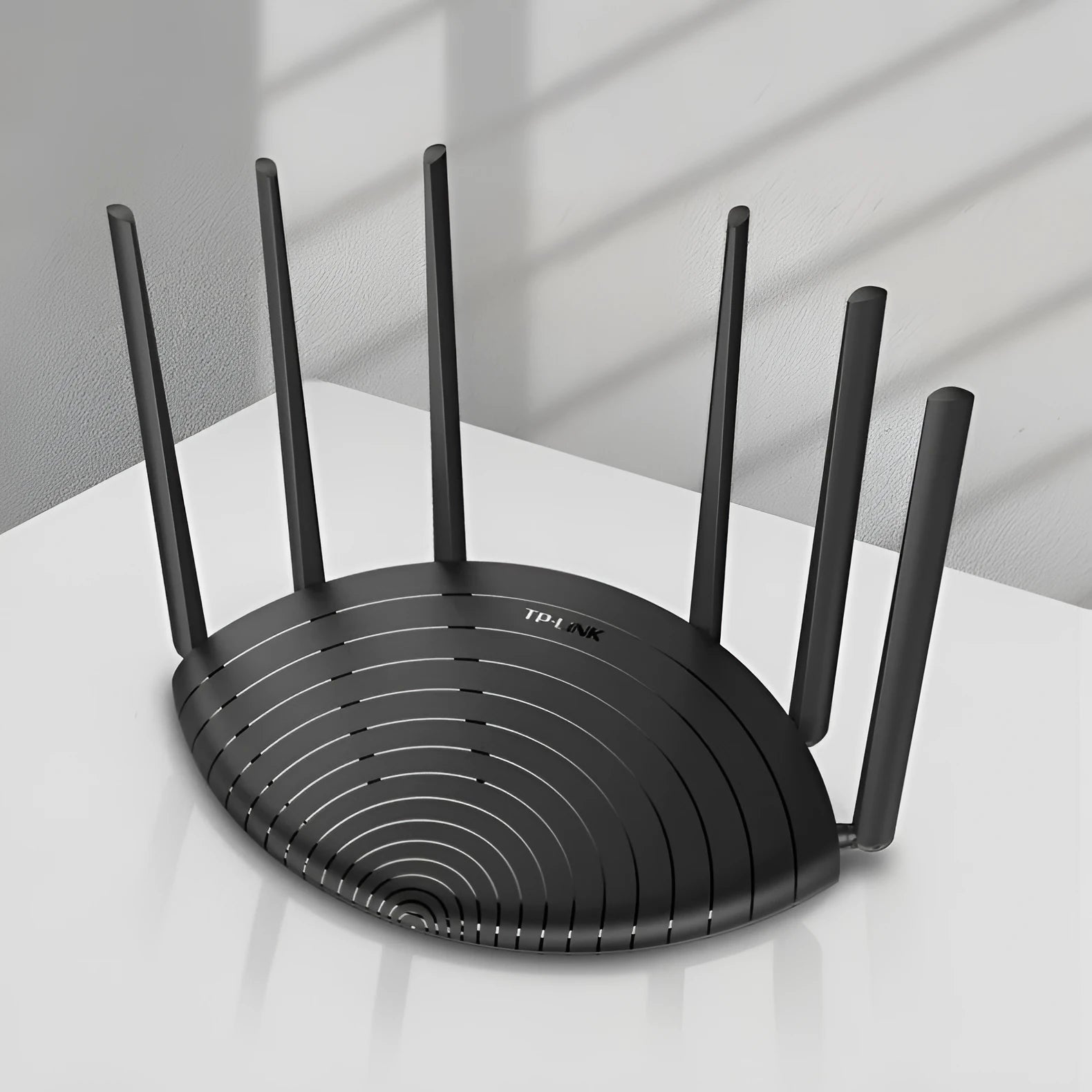 TL-WDR7661 gigabit wireless router with AC1900 dual-band Wi-Fi and compact black design