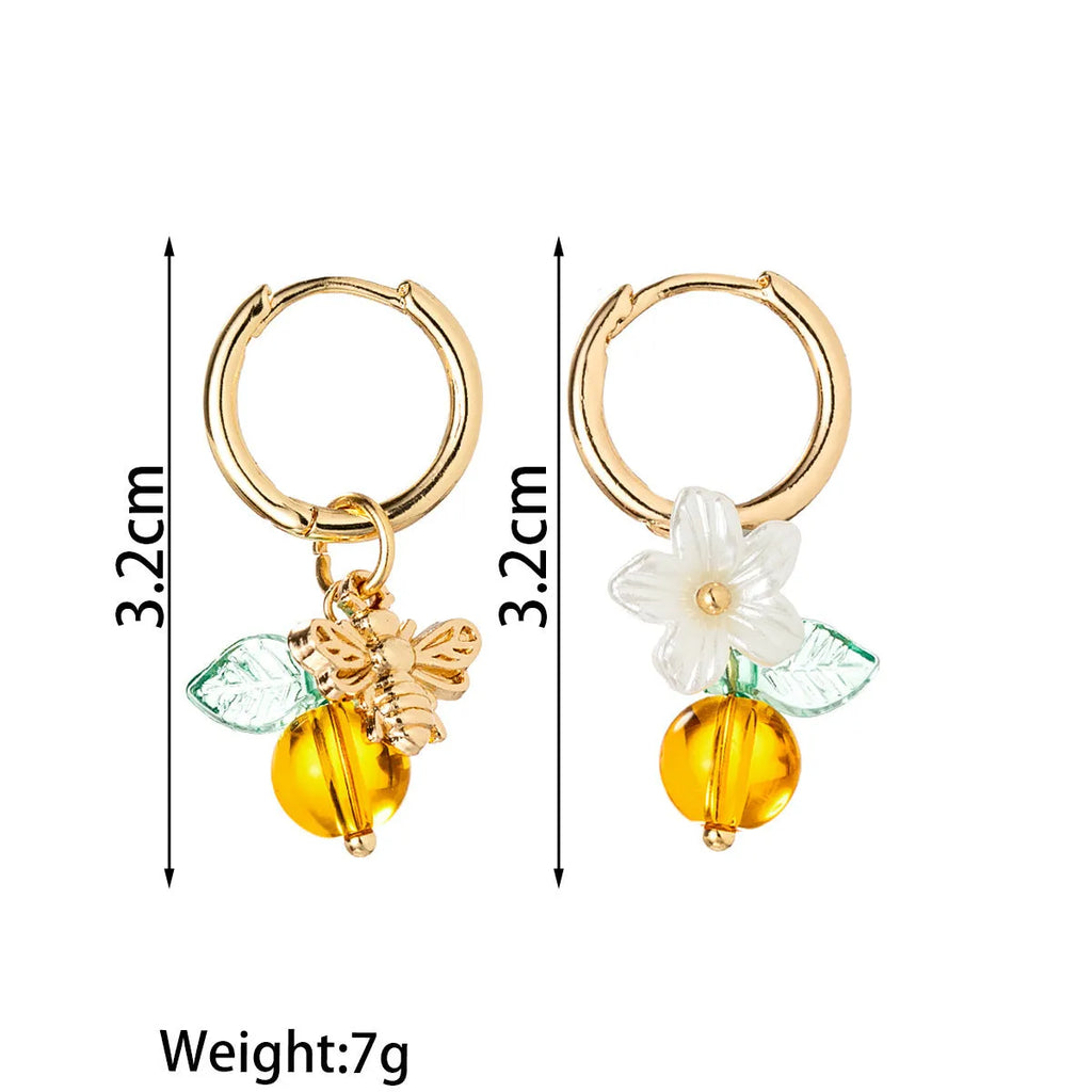 Women's sweet ear cuffs in XY-123 with bee, glass, leaf, and flower pendant details, supplied as one pair.