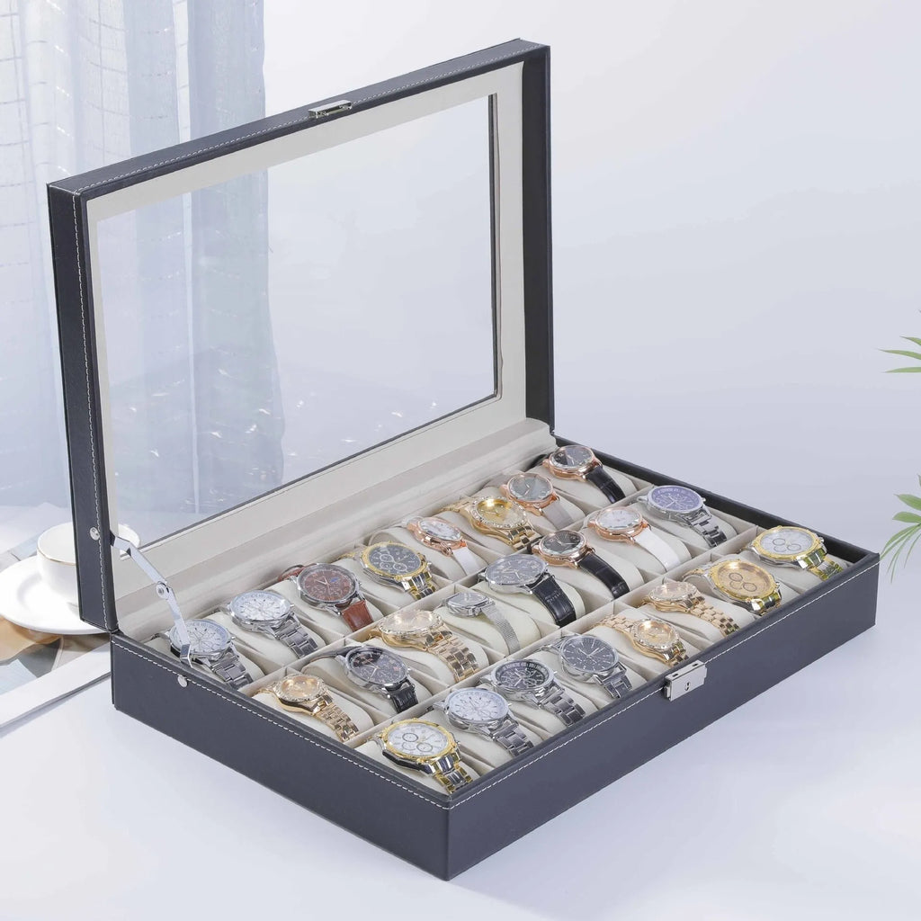 Grey leather watch storage box with clear dustproof lid showing multiple watch slots inside.