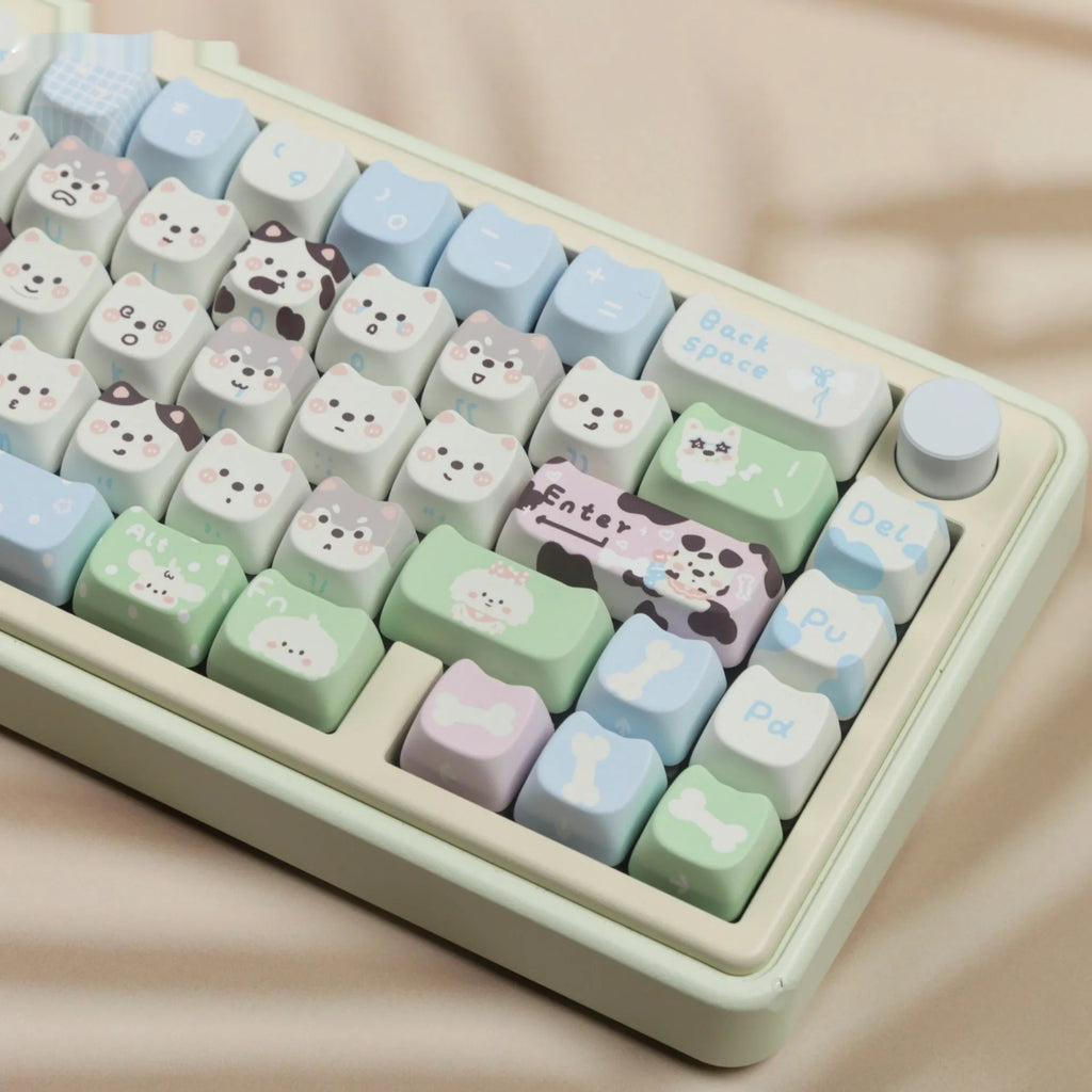 PBT sublimation keycap set showing cat and puppy character designs on mechanical keyboard keys
