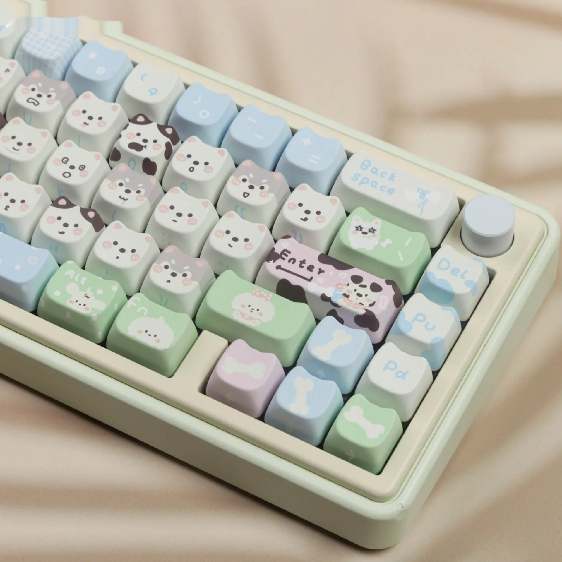 PBT sublimation keycap set showing cat and puppy character designs on mechanical keyboard keys