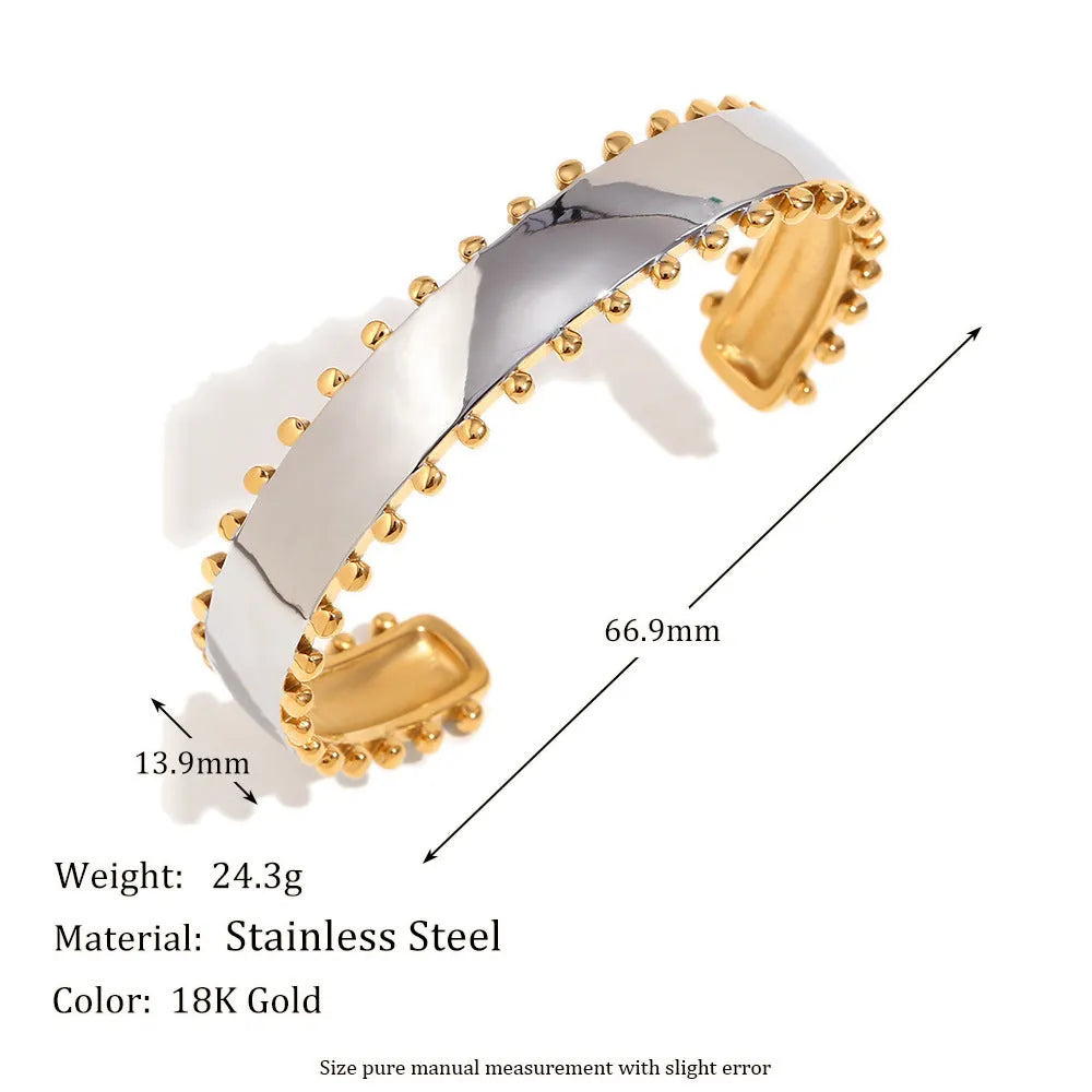 Gold tone electroplated stainless steel jewellery set with geometric shapes including earrings, bracelet and necklace