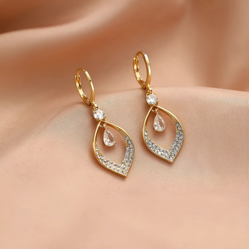 Women's gold and silver water drop tassel earrings made from zircon and copper.