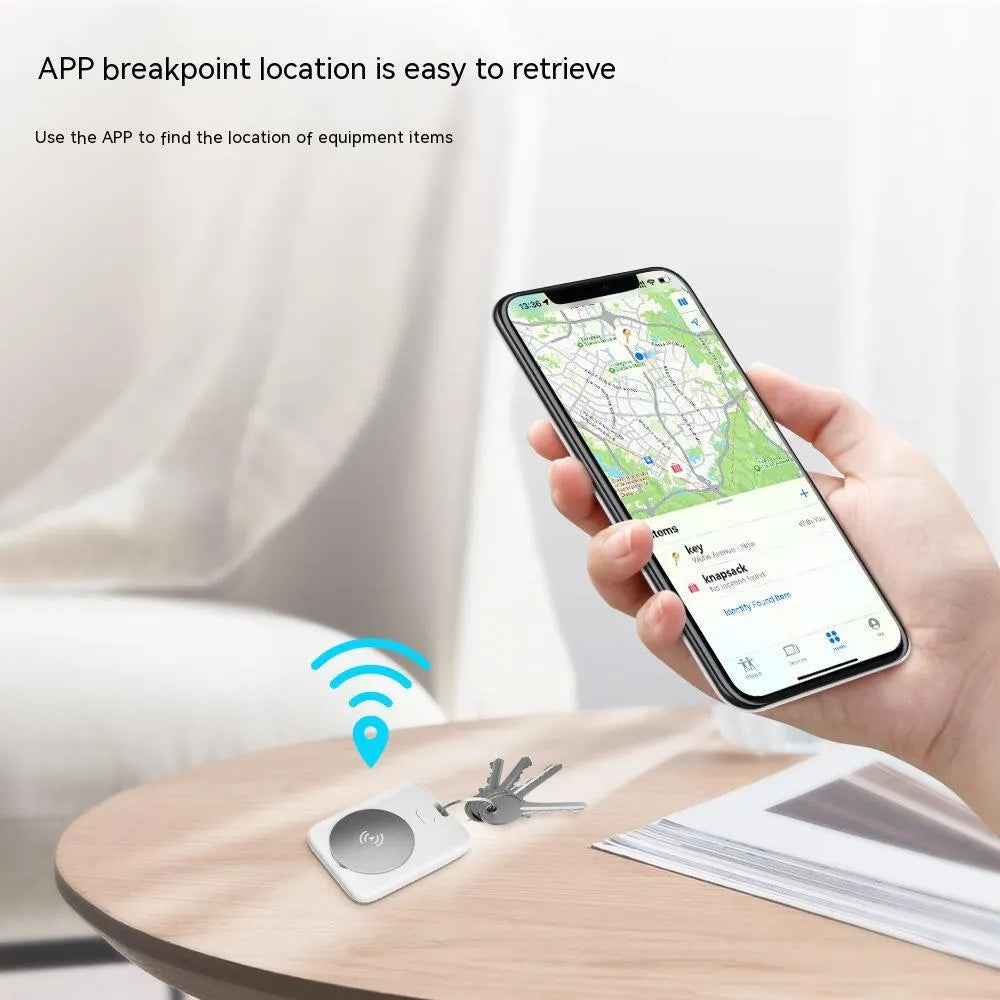 White ABS plastic pet tracking device for Apple users showing portable design