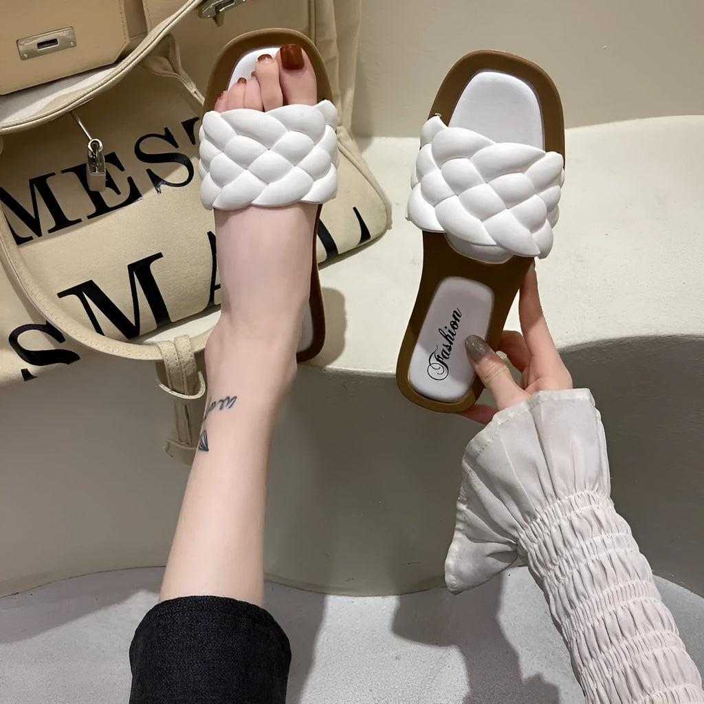 Women's PVC beach sandals with a thick non-slip sole in black, shown on a white background.