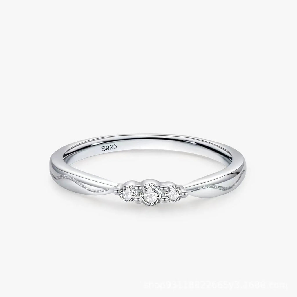 S925 sterling silver ripple wave ring with white gold electroplated finish on white background