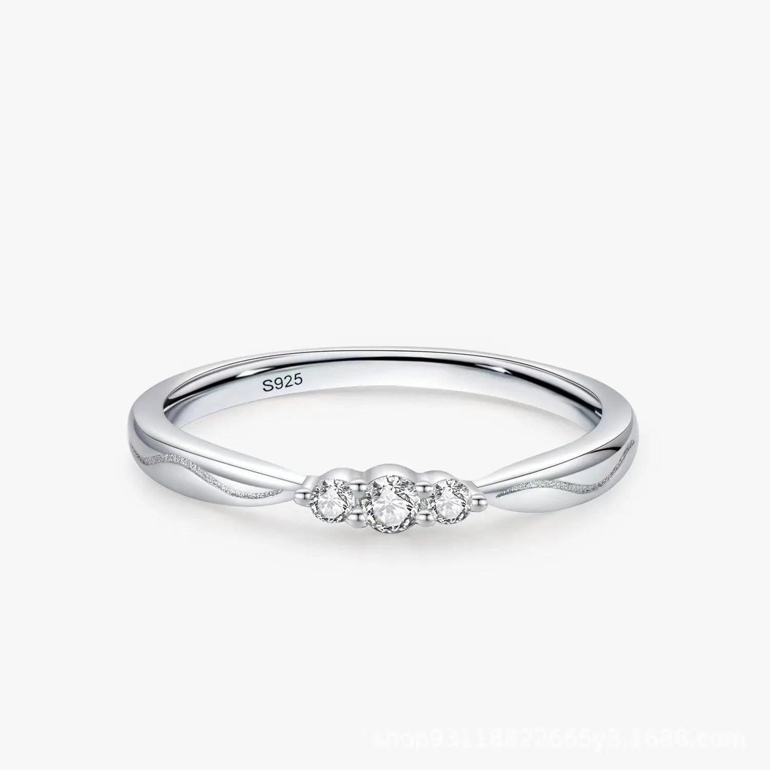 S925 sterling silver ripple wave ring with white gold electroplated finish on white background