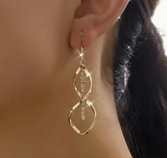 Geometric spiral design earrings with electroplated gold finish and ellipse shape