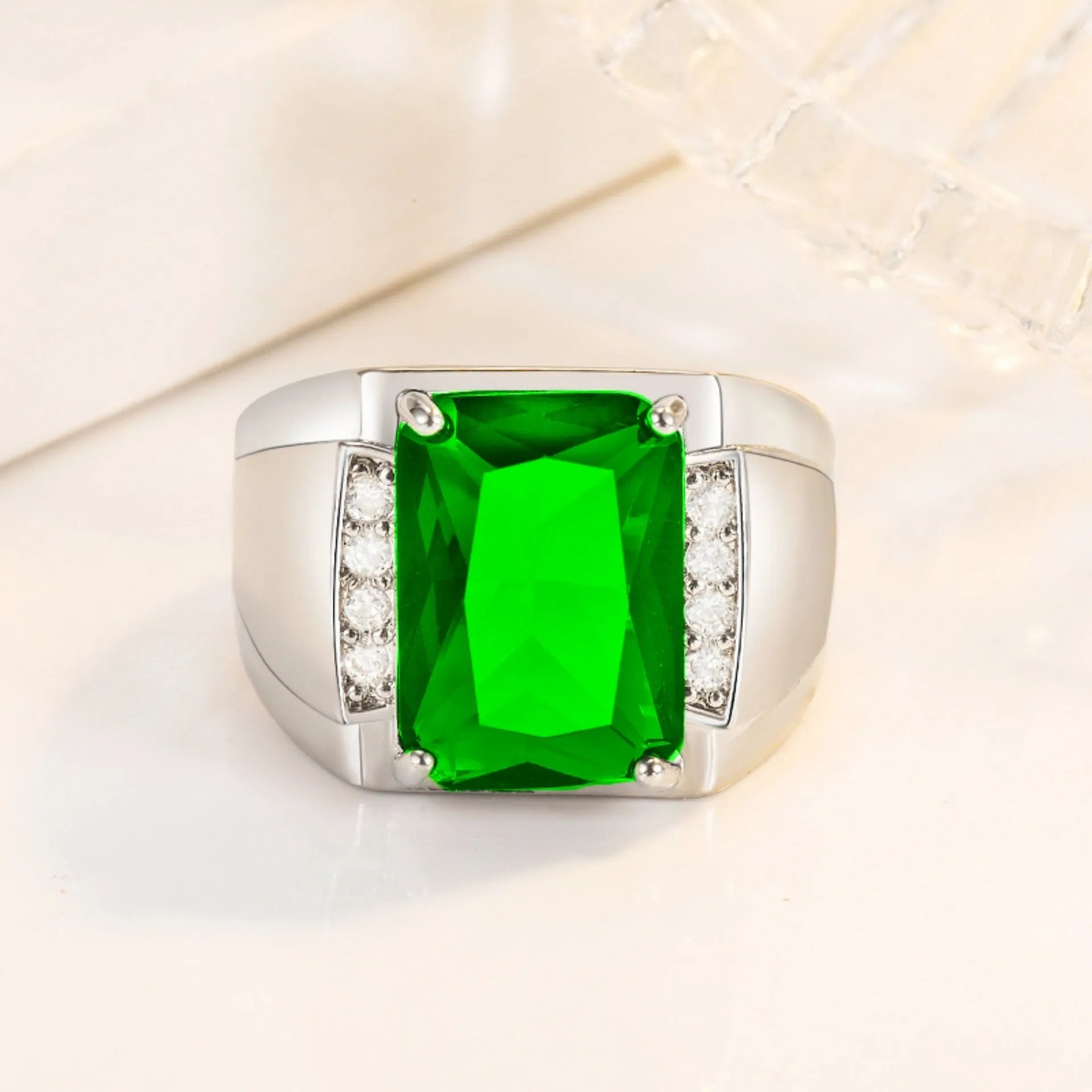 Adjustable copper ring with geometric band and a colourful rhinestone in a white gold coloured setting.