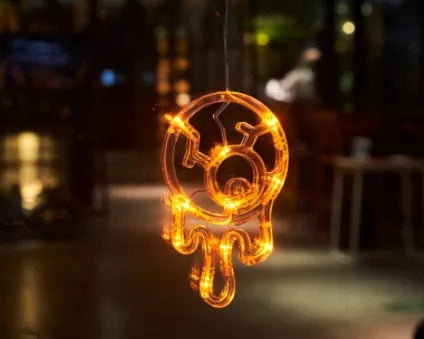 Halloween LED hanging lights with spider, pumpkin and ghost designs featuring suction cups for window mounting