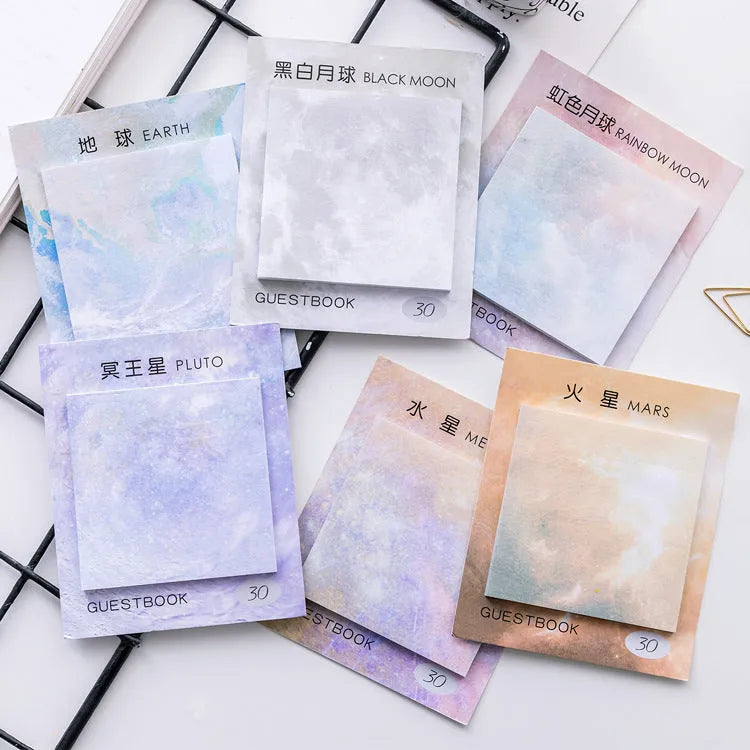 Square planet sticky notes notepad showing oil painting artwork of Earth, Mars, and moon designs.