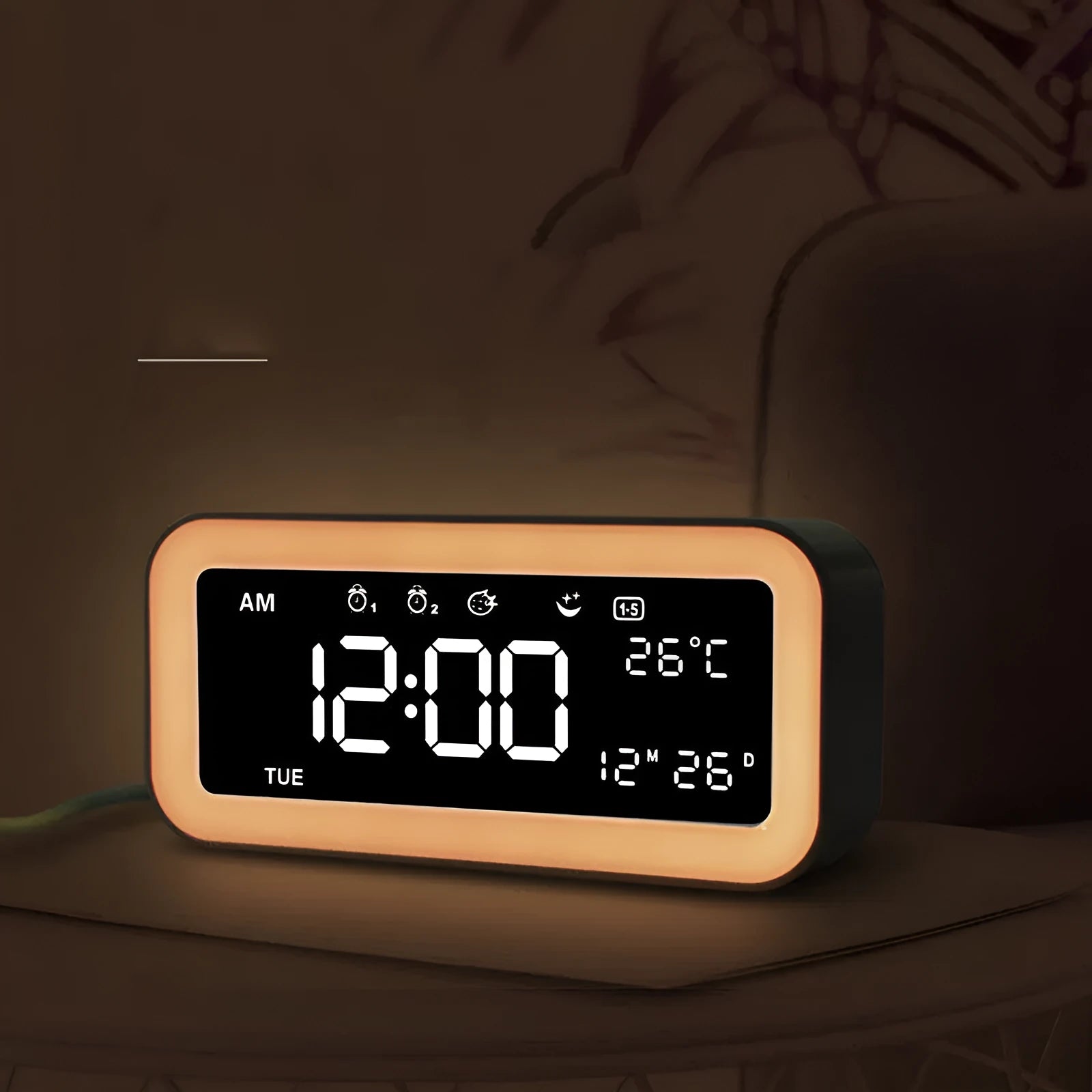 Blue rectangular LED atmosphere light alarm clock with digital display on a table.