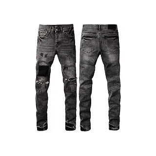 Black slim fit straight leg men's jeans with a button fly on a mannequin.