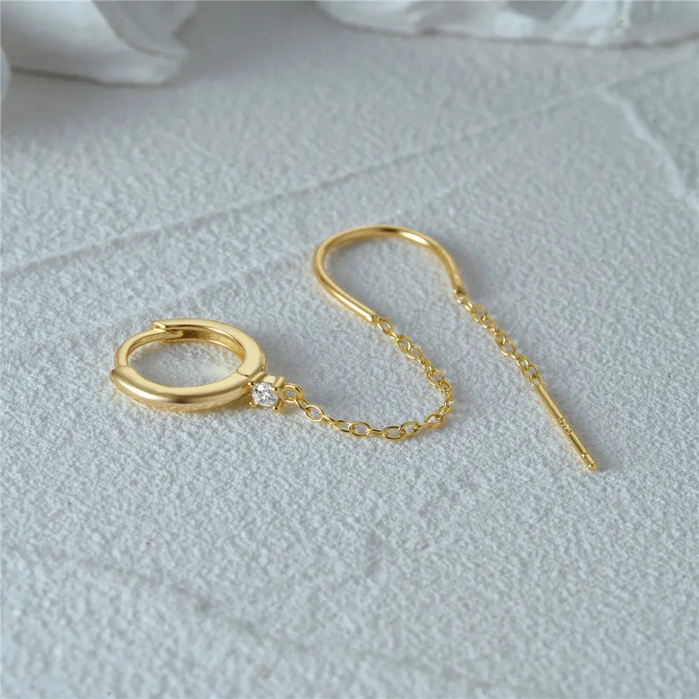 S925 sterling silver geometric drop earring with flower and tassel chain detail in a golden colour.