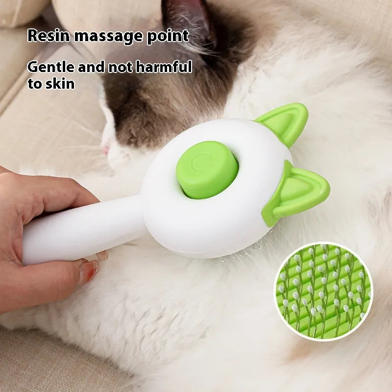 Greenish white and orange white self-cleaning cat comb with stainless steel bristles for pet hair removal.